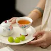 Estilo Dinastía Tang y Song Cerámica Blanca Pintada a Mano Peonía Taza Maestra de Pie Alto Juego de Té Kung Fu Taza de Té Cerámica para el Hogar