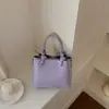 Bolsa Quadrada Pequena Fashionável Exquisita Estilo Coreano Nova Primavera Bolsa de Mão Transversal Feminina Bolsa de Ombro Versátil com Toque de Luxo PU