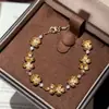 Artesanía de trefilado pulsera de osmanthus pulsera de osmanthus de alta calidad temperamento dorado lujo ligero alta calidad