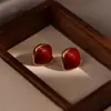 Pendientes Únicos Rojos de Ankara Lujo Ligero Sensación de Alta Gama Pendientes de Botón Nuevo Estilo 2026 Más Vendidos Femeninos Otoño Invierno Año Nuevo Pendiente