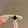 Pulsera de trébol de cuatro hojas dulce de flor micro-incrustada de doble capa 2024 para enviar pulsera de novias joyería nicho joyería para mujer