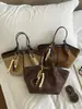 Bolso de Hombro Simple Nuevo Otoño 2026 Moda Viaje Diario Bolso de Axila de Alto Valor Bolso Cubo Retro de Gran Capacidad