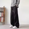 Pantalones casuales holgados versátiles de moda de otoño para hombre, pantalones largos rectos simples, elegantes y relajados de color liso, nuevos
