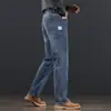 Jeans de alta gama con forro polar para hombre de Hong Kong, nuevos pantalones de negocios rectos holgados para otoño e invierno, pantalones largos casuales elásticos