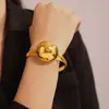 Pulsera de moda europea y americana pulsera de acero de titanio hueca de bola grande diseño de personalidad exagerada joyería al por mayor chapada en oro de 18k