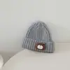 Chapéu de boneca estiloso e versátil em retalhos, chapéu de lã infantil transfronteiriço, novo chapéu de tricô quente de outono e inverno para meninos
