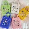 Bolsa mini portátil especial transfronteiriça de espuma EVA tipo gelatina feminina com adesivos criativos e furos coloridos de proteção ambiental