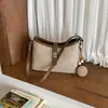 Bolso de diseño de nicho de alta gama transfronterizo para mujer, nuevo modelo otoño 2026, bolso de hombro y bandolera versátil retro coreano simple