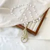 Cadena de suéter de zorro atmosférica de alta gama estilo coreano, collar largo de perlas de otoño e invierno, todo partido, accesorios de ropa de alta gama, colgante