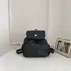 Mochila con cordón de lunares estilo coreano 2026 Nueva mochila casual ligera con un ambiente juvenil, mochila versátil de doble uso para salidas