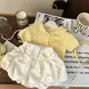 Nuevo Conjunto de Verano para Niñas 2026: Conjunto de Top de Punto Hueco Dulce y Elegante de Manga Corta con Lazo y Pantalones Florales
