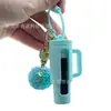 Estuche de silicona para labiales de nuevo producto transfronterizo, llavero portátil para exteriores anticaídas, estuche protector para labiales y brillos de labios, almacenamiento de botellas de aceites esenciales