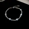 [Cadena de Diamantes Arcoíris] Pulsera de extracción de zircón trenzado en cruz, una pulsera lujosa y de alta gama, una pieza de joyería delicada y de moda