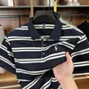 Top de punto a rayas con solapa y manga corta para hombre 2026 Verano Nuevo Polo Casual de Negocios para Hombre