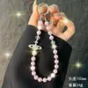 Nueva Cadena para Teléfono Móvil Saturno Incrustada de Diamantes Muñequera Cadena para Teléfono Móvil con Perlas y Cuentas Colgante Versátil para Bolso Llavero para Mujeres