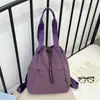 Mochila de cordón de nailon estilo minimalista japonés transfronteriza, casual y versátil, adecuada para estudiantes, clases, yoga, con múltiples opciones de transporte, también se puede usar como bolso de hombro