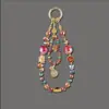 Pingente de Celular Borboleta Flor com Contas de Cristal, Corrente de Pulso Elegante e Doce de Abóbora com Toque de Luxo, Abóbora de Cristal