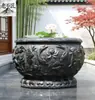 Aquário de flor de pedra esculpida vaso de flor de pedra azul natural tanque de lótus antigo tanque de peixe de pátio ornamento externo porta tanque de pedra do mar