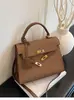 Bolsos de Mujer de Moda de Este Año 2026 Primavera y Otoño Nuevo Bolso Kelly para el Trabajo Pequeño Cuadrado Elegante de Hombro Cruzado