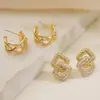 Brincos Geométricos Aogu Transfronteiriços Simples e Personalizados Banhados a Ouro Real com Zircônia para Mulheres Ins Nicho Luxo Acessível Brincos Versáteis