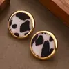 Pendientes de botón geométricos redondos con estampado de leopardo, de moda transfronteriza, ligeros y chic, adecuados para el uso diario y versátiles para cualquier atuendo.