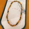 Pulsera apilada de cuentas de vidrio y ojo de tigre, sensación de lujo ligero de nicho de alta gama, accesorio de muñeca versátil casual Maillard