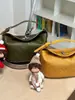 Bolso de mujer 2026 modelo nuevo, bolso tejido de un solo hombro cruzado, bolso cuadrado pequeño elegante, versión coreana de moda, bolso versátil para debajo del brazo con un ambiente elegante