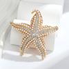 Broche de Estrella de Mar de Diamantes de Moda Europea y Americana Estrella de Cinco Puntas Broche Personalizado Joyería Accesorios de Ropa Listo para Entrega al Mayoreo
