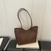 Bolsa tote moderna de alto valor 2026 Outono novo estilo fashion de alta qualidade bloqueio de cores grande capacidade versátil ombro único de mão