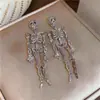 Pendientes de borlas con incrustaciones de diamantes transfronterizos europeos y americanos, pendientes exagerados de moda de nicho de alta gama, lujo ligero, pendientes únicos y elegantes para mujer