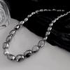 Estilo europeo y americano temperamento personalizado irregular cuentas perlas apiladas cadena clavícula moda piedra biliar negra suéter suéter