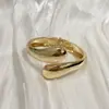 Pulsera para mujer al por mayor nueva lisa transfronteriza personalidad aleación redonda simple chapado apertura pulsera que no se desvanece