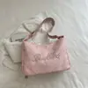 Bolsa casual estilo coreano para o dia a dia de mulheres, nova bolsa de ombro trendy de estrela para o verão de 2026, bolsa tote transversal para viagens diárias