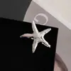 Broche de Metal de Acero Inoxidable Estilo Festivo Europeo y Americano Estrella de Mar Plateada Creativo de Costa Moda de Gama Alta Nicho Pecho