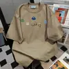 Camiseta Divertida Estampada de Manga Curta Estilo Coreano de Nicho High-End para Mulheres Verão 2025 Roupa de Trabalho Marca Tendência Top Solto
