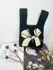 Bolso nuevo de punto fly bolso de mano para mujer bolso cubo de lana tejido bolso tote casual versátil de mano estilo japonés y coreano bolso para lonchera