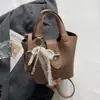 Transfronterizo 2026 Verano Nuevo Estilo Coreano Bolso de Mano Versátil de Gran Capacidad Casual para Viajes Diarios Bolso Cruzado de Hombro Tipo Cubo para Mujeres