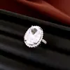 Set de aretes, collar y anillo de circonia con aguja de plata transfronterizo, joyería de alta gama de lujo ligero con un toque exquisito y elegante