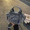 Bolsa tote pequena super popular para mulheres, nova moda 2026 simples de jeans para o dia a dia, bolsa transversal casual