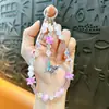 Cadena para teléfono móvil con lazo de aleación con cuentas, llavero, colgante, funda de teléfono móvil, correa de muñeca, accesorios para bolso, regalo pequeño, venta al por mayor