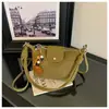 A bolsa de dumpling trançada popular deste ano para mulheres é a nova bolsa de ombro simples da moda de 2026, uma bolsa transversal de nicho estilo coreano