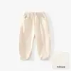 Ropa infantil Anyang colección otoño pantalones casuales para niños pantalones deportivos color liso pantalones largos nuevos pantalones bordados pantalones jogger para niños modernos