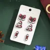 Serie Navideña Europea y Americana Set Combinado de Pendientes Papá Noel Dibujos Animados Lindos Set de Pendientes Personalizado Venta al por Mayor