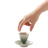 Taza de té pequeña de cerámica de color degradado creativo Juego de dos piezas Taza de té para el hogar Taza de maestro Taza de té giratoria Posavasos para taza de té Taza de agua
