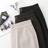 Pantalones rectos de pierna ancha de alta gama y corte slim para mujer, nuevo estilo otoño e invierno 2026, pantalones para mujeres de mediana edad y mayores, cintura elástica, pantalones de pierna ancha de color liso