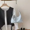 Moda de Primavera 2026 Tendencia Nicho Nicho Alta Apariencia Bolso de Hombro Único Bolso Tote Textura Superficie Brillante Femenino