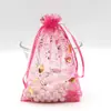 Venta al por mayor de bolsas de malla con estampado de buganvilias y lámina dorada listas para enviar, bolsas para dulces, bolsas para dulces con forma de huevo, bolsas para empaquetar dulces, bolsitas con cordón para joyería y bolsas de regalo