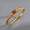 Pulsera Transfronteriza de Acero Inoxidable Europea y Americana Pulsera de Acero de Titanio Piedra Ojo de Tigre Pulsera de Pareja Simple Versátil Moderna Elegante Pulsera Abierta