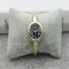 Reloj de Pulsera Estilo Literario Estudiante Reloj de Cuarzo Dorado Ovalado Moda Reloj para Niñas Esfera Romana Reloj Dorado para Damas