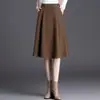 Nueva falda de mujer elegante, sencilla, de color liso, nueva para otoño e invierno 2026, de cintura alta, adelgazante, con dobladillo grande que cubre las caderas, falda de línea A
